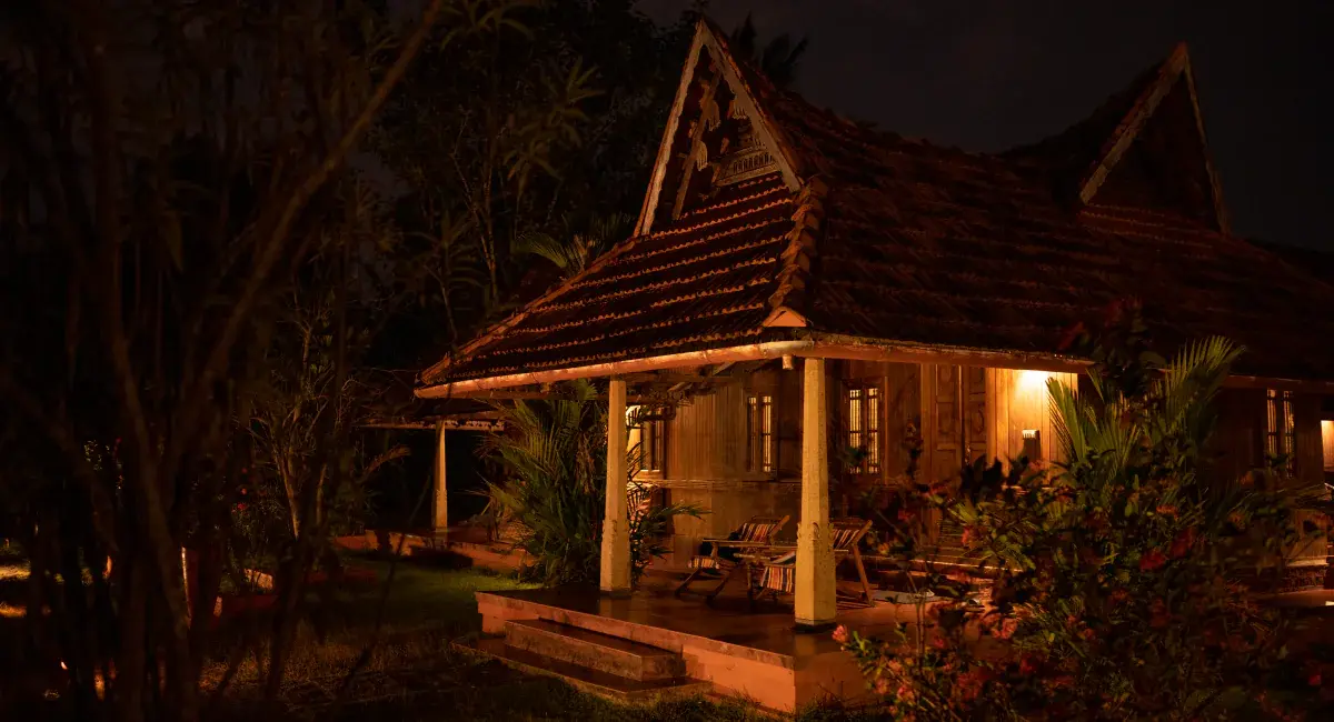 Cottage lit up at night