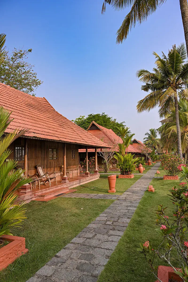 Stone path between the tiled-roof cottages