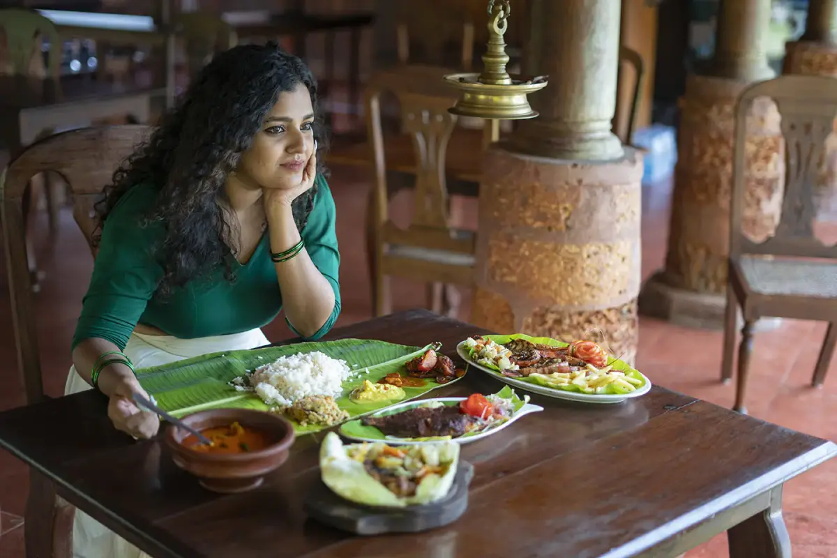 A traditional Kerala meal on banana leaf at the Oottusala