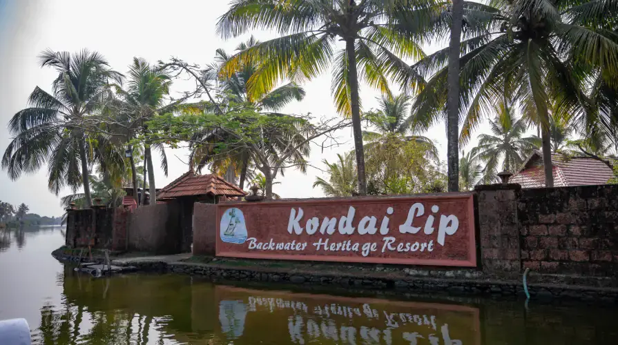 The Kondai Lip laterite jetty and signboard on the water's edge
